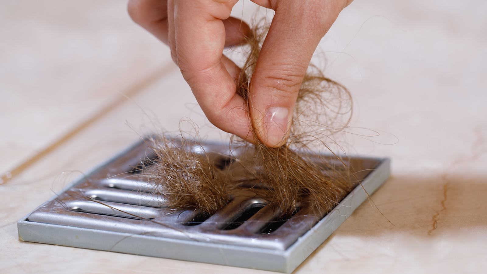 Removing clump of hair from shower drain